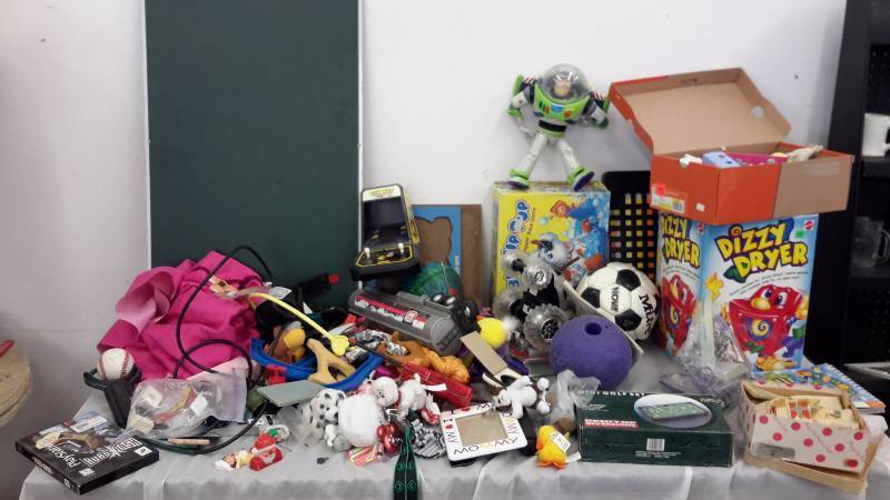 Huge assortment of toys, puzzles, balls, remote controls