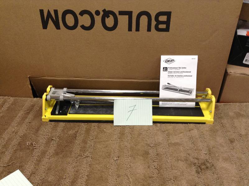 lot 7 image: QEP 21 in. Manual Tile Cutter with 10 mm post style cutting wheel  in like New working conditions