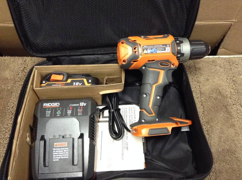 lot 12 image: RIDGID 18-Volt Lithium-Ion 12 in. Cordless Compact DrillDriver Kit open box never used