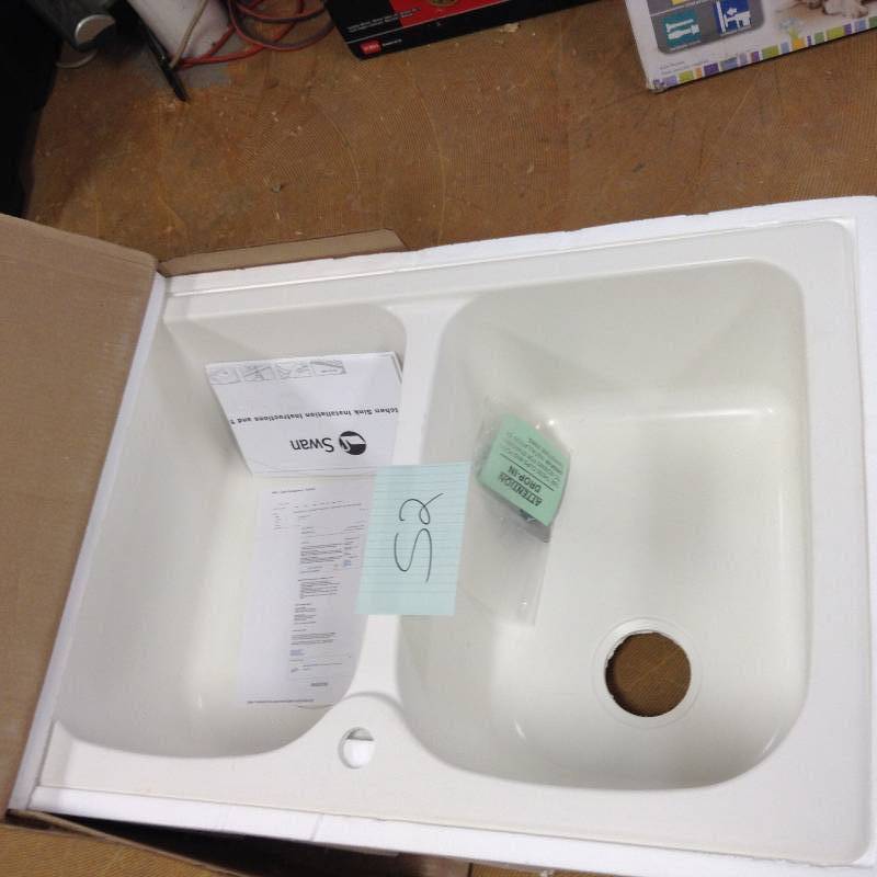 lot 52 image: Dual Mount Composite 33 in. 1-Hole Double Basin Kitchen Sink in White  Model # KS02233LB.010 open box never used