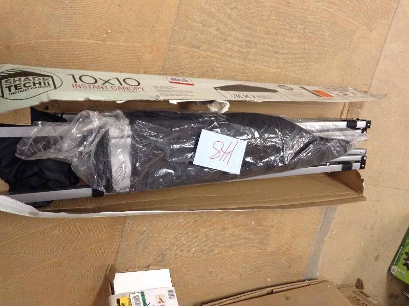 lot 148 image: Shade Tech ST100 10 ft. x 10 ft. Instant Patio Canopy in Black Model#  157464 open box never used