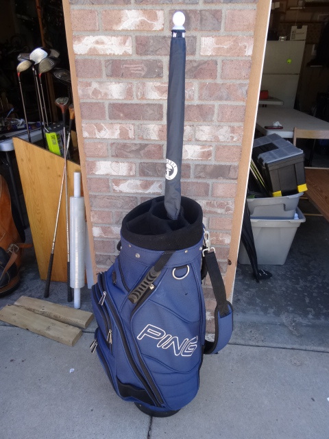 lot 87 image: Ping Golf Bag with a Drizzle Stick Club