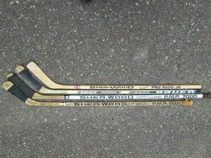 lot 293 image: 4 Left Handed Hockey Sticks