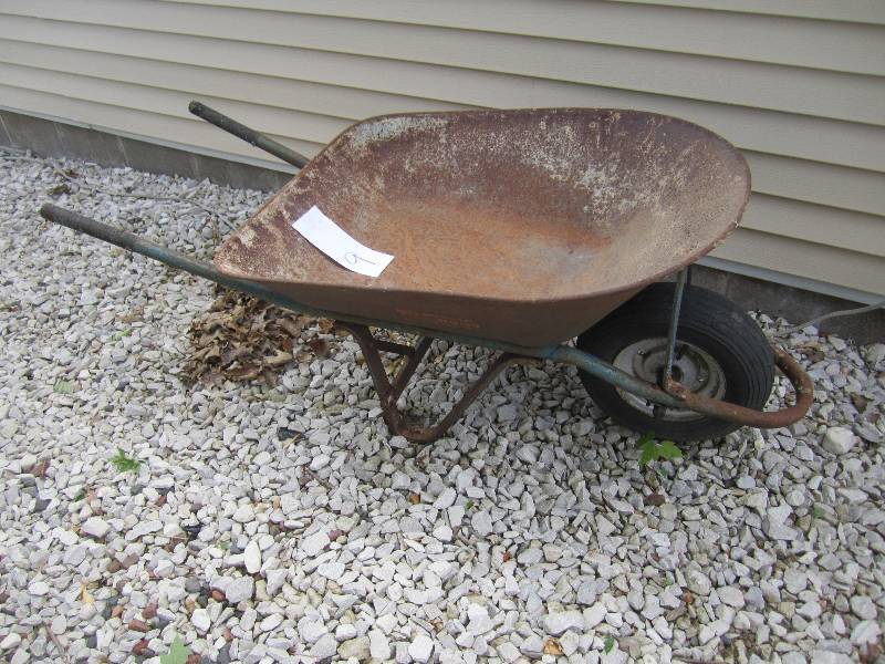Wheelbarrow with sturdy metal frame...