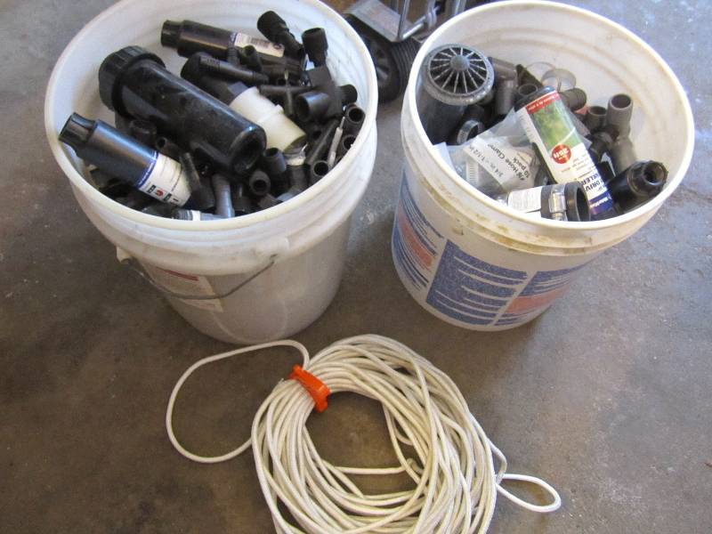 2 buckets of plastic irrigation and...