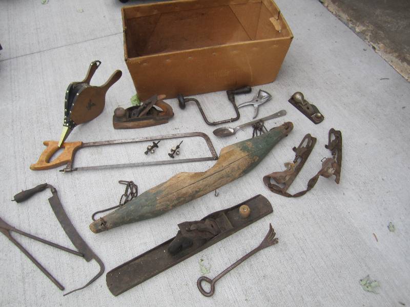 Box filled with antiques tools, ska...