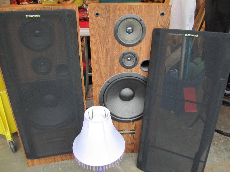 2 Pioneer speakers and a purple lam...