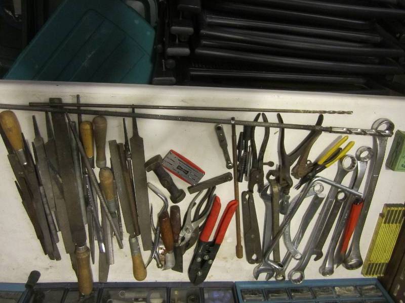 Blue tote of hand tools...