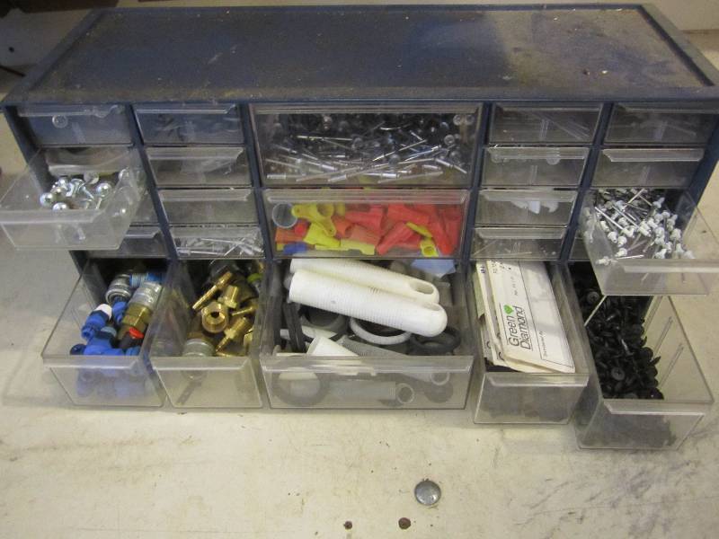 Organizer filled with rivets wire n...