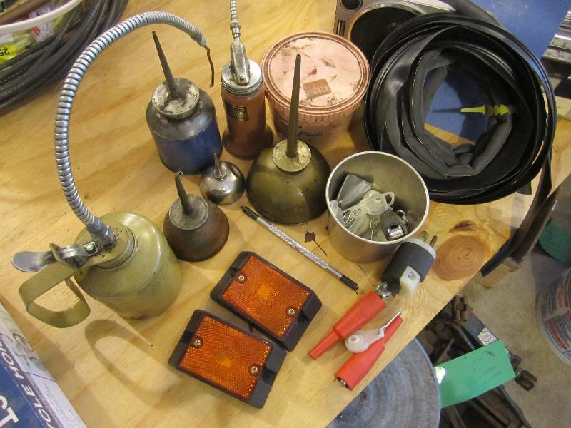Lot of oil cans, reflectors and doo...