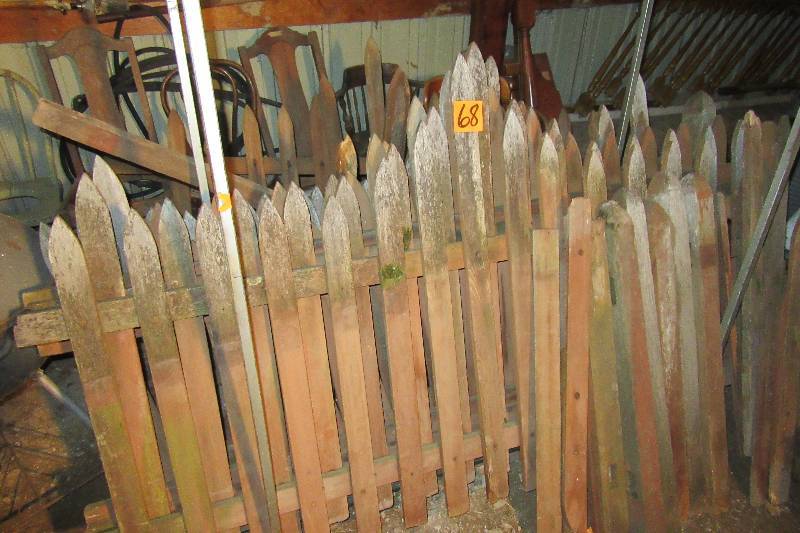 lot 68 image: 7, 7ft sections of picket fence.. Needs some repair, but most of the pickets are there and the connecting pieces.. Some pieces and pickets need to be replaced or nailed back in place.