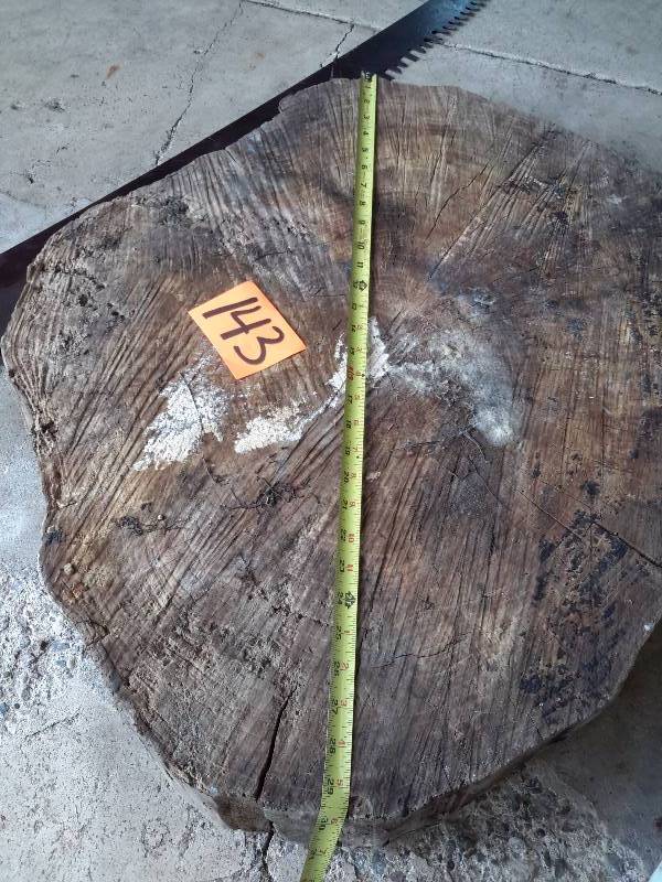 lot 143 image: Large slab of wood and cross cut saw