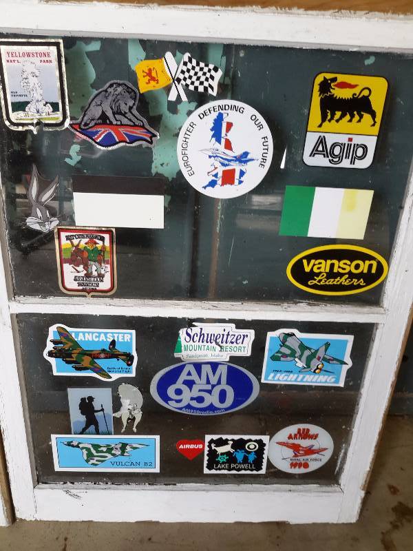lot 144 image: 2 double hung window sashes with commemorative stickers