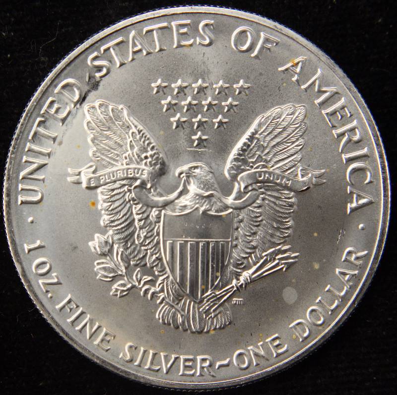 lot 45 image: 1991 AMERICAN SILVER EAGLE 1 TROY OZ. .999 FINE SILVER DOLLAR