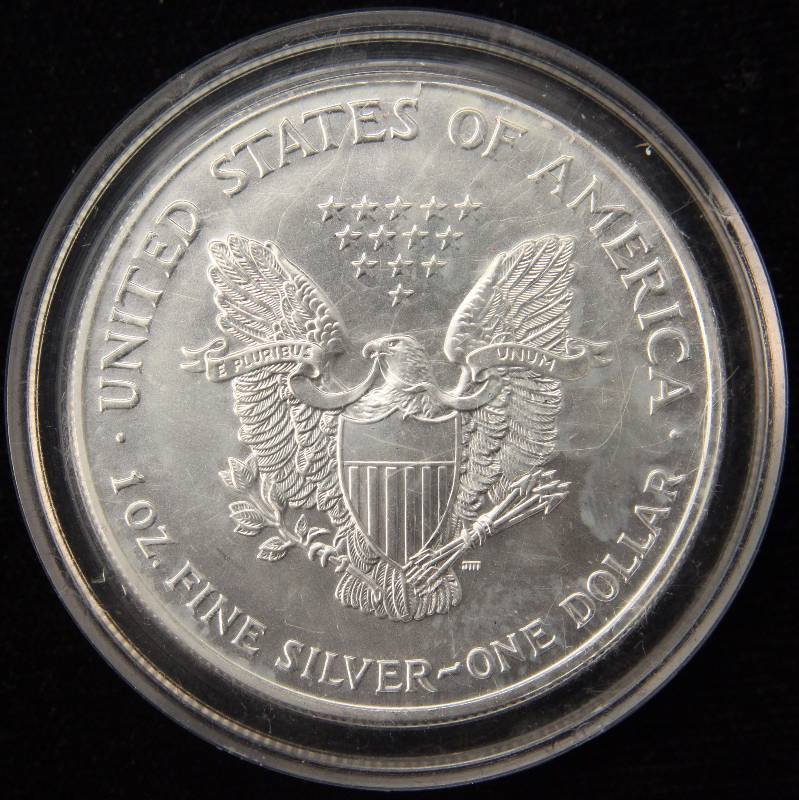 lot 50 image: 1999 COLORIZED AMERICAN SILVER EAGLE 1 TROY OZ. .999 FINE SILVER DOLLAR IN AIRTITE