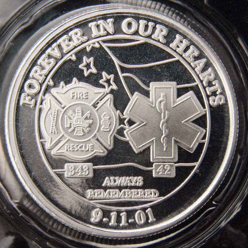lot 63 image: 1 TROY OZ. .999 FINE SILVER 911 COMMEMORATIVE SEALED