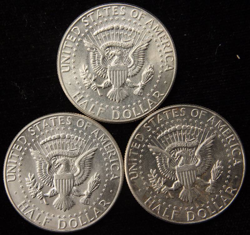 lot 67 image: GROUP OF 3 KENNEDY SILVER HALF DOLLARS 1964