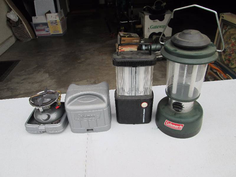 lot 90 image: White Gas Stove, Coleman Electric Lantern, and Rayovac Workhorse Light