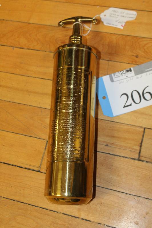 lot 2061 image: Vintage 1952-1955 Quickaid Chris Craft Boat Gold Fire Extinguisher