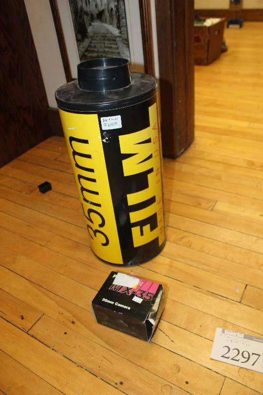 lot 2297 image: Vintage Photo Equipment,Decorations Includes Photoflex MX-35 35mm Camera, Decorative 35mm Film Canister 9in. Diameter, 19in. Tall