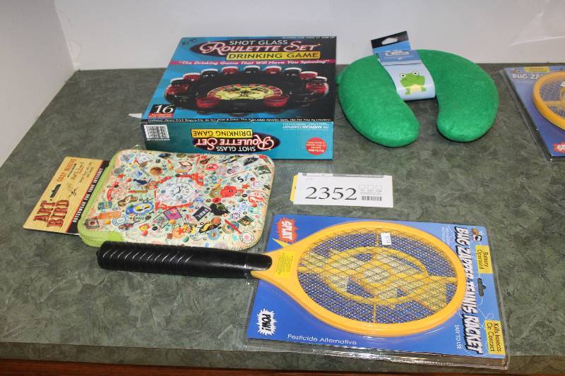 lot 2352 image: Lot of (4) Sleeping Neck Brace, Electric Bug Tennis Racket, Roulette Set, Art Bird iPad Sleeve