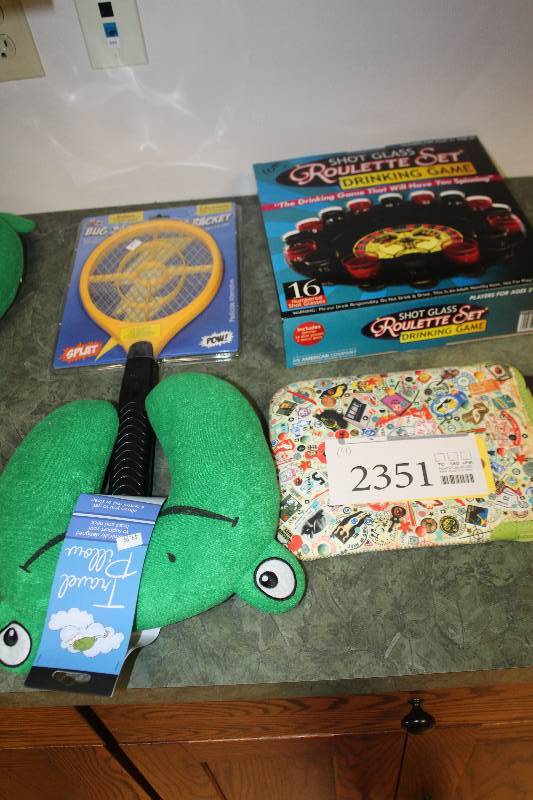lot 2351 image: Lot of (4) Sleeping Neck Brace, Electric Bug Tennis Racket, Roulette Set, Art Bird iPad Sleeve