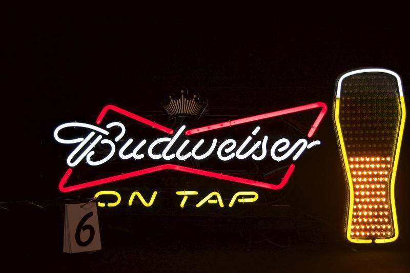 lot 6 image: Awesome Budweiser On Tap bowtie neon lighted sign with sequential filling glass. Glass fills and then empties, then repeats. Excellent condition