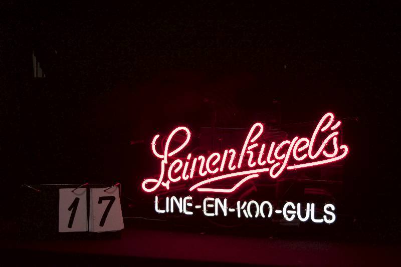 lot 17 image: Leinenkugels neon, animated to phonetically spell Line-En-Koo-Guls, hard to get sign. See the video.