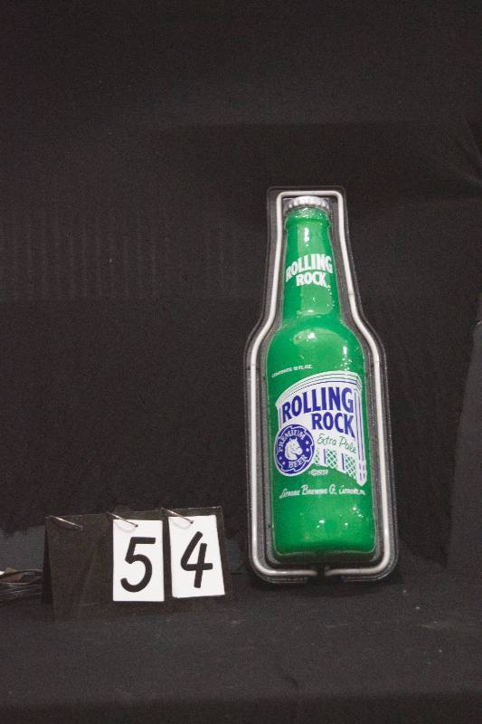 lot 54 image: Rolling Rock 3D plastic bottle with neon outline and animated LEDs to simulate carbonation bubbles. Very Cool. Check out the video.