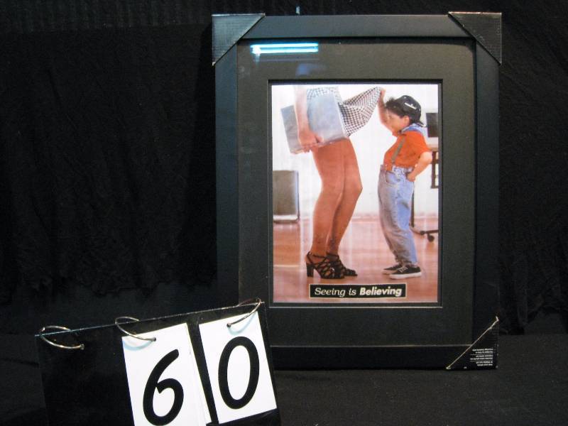 lot 60 image: Seeing is Believing framed print of a curious little boy