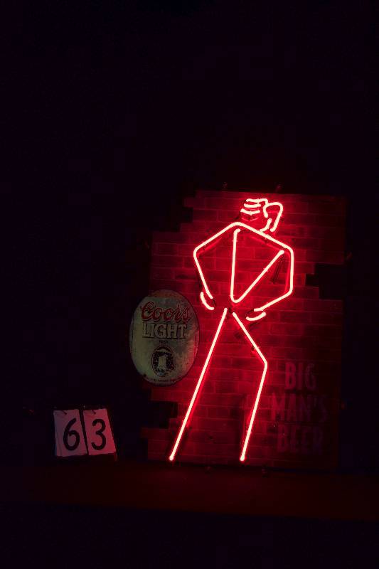 lot 63 image: Coors Walking Man neon sign