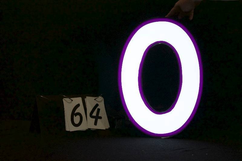 lot 64 image: O LED lit channel letter, has power supply and is ready to hang