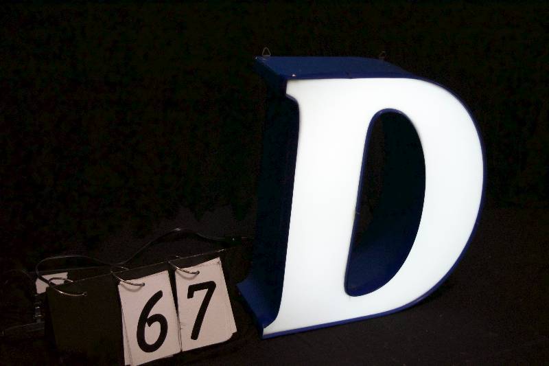 lot 67 image: D neon lit channel letter, has power supply and is ready to hang