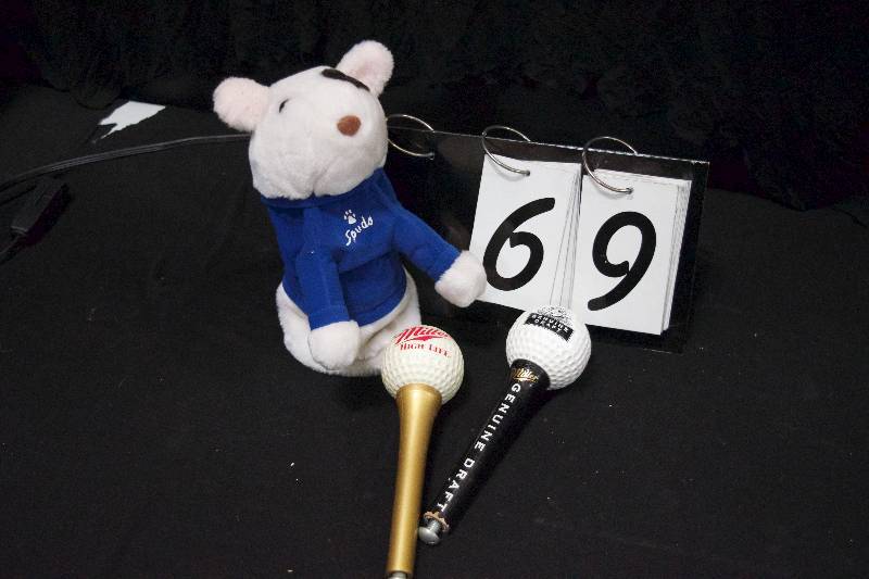 lot 69 image: Golf package for dad, Bud Light Spuds MacKenzie club head cover and 2 golf ball beer tappers Miller High Life and Miller Genuine draft