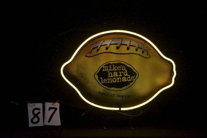 lot 87 image: Mikes Hard Lemonade football lemon with neon border tube