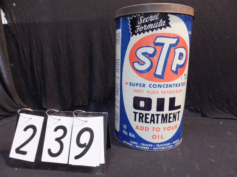 lot 239 image: STP Oil Treatment garbage can with lid, has coin slot in lid,