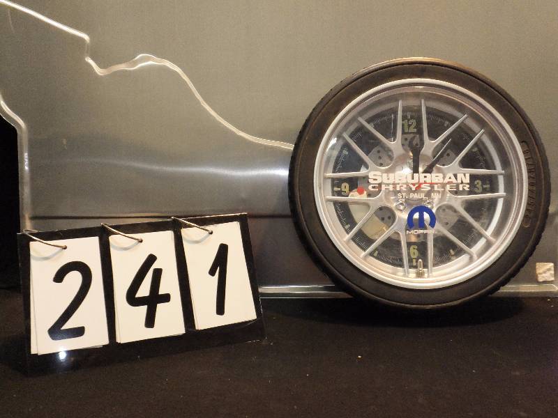 lot 241 image: Suburban Chrysler rim and wheel clock, rubber wheel, battery powered, clock works