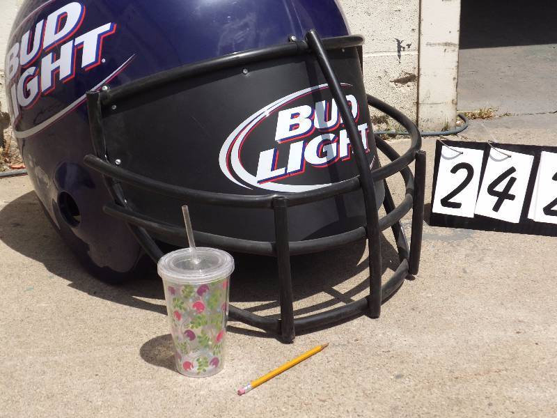 Bud Light giant football helmet display hangs from