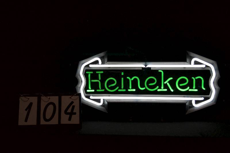 lot 104 image: Heineken neon logo with plastic shroud around border