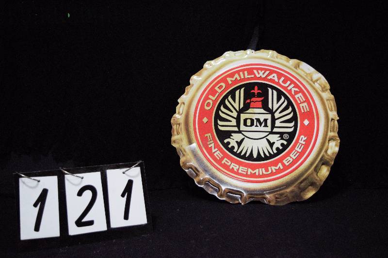 lot 121 image: Old Milwaukee Beer bottle-cap shaped tin sign