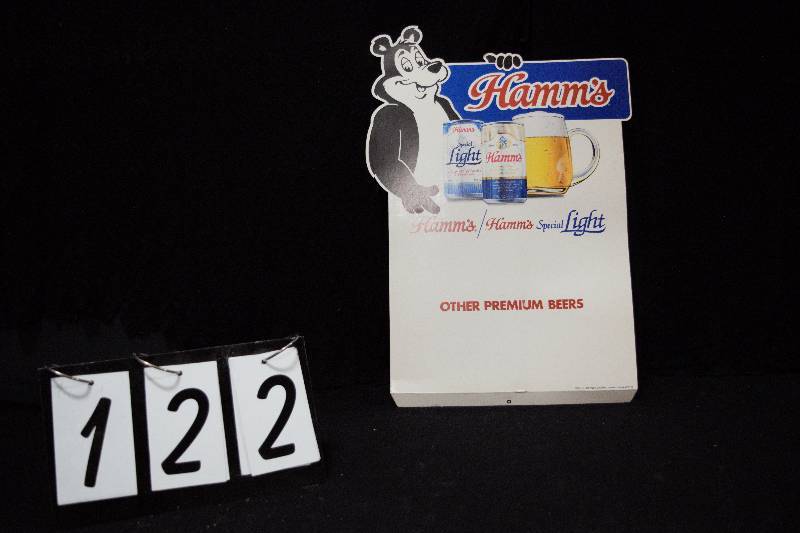 lot 122 image: Hamms Beer diecut easle back posters in unused condition, Its Here and Other Premium