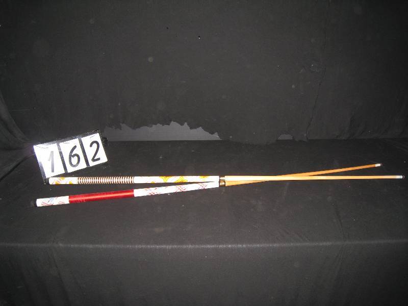 lot 162 image: 2 beer branded pool cues, 1 Miller High Life, 1 Budweiser