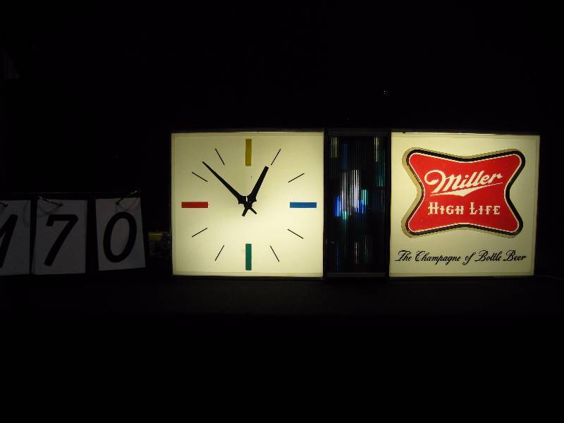lot 170 image: Miller High Life clock, 60s mod style, nice clean conditin