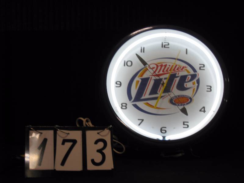 lot 173 image: Miller Lite neon clock (heavy duty), 1-piece spun aluminum clock body with glass front