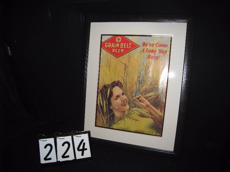 lot 224 image: Grain Belt Girl laying in the barley, framed and matted poster