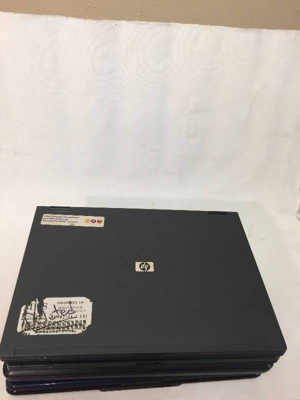 lot 62 image: Four Laptops and two chargers