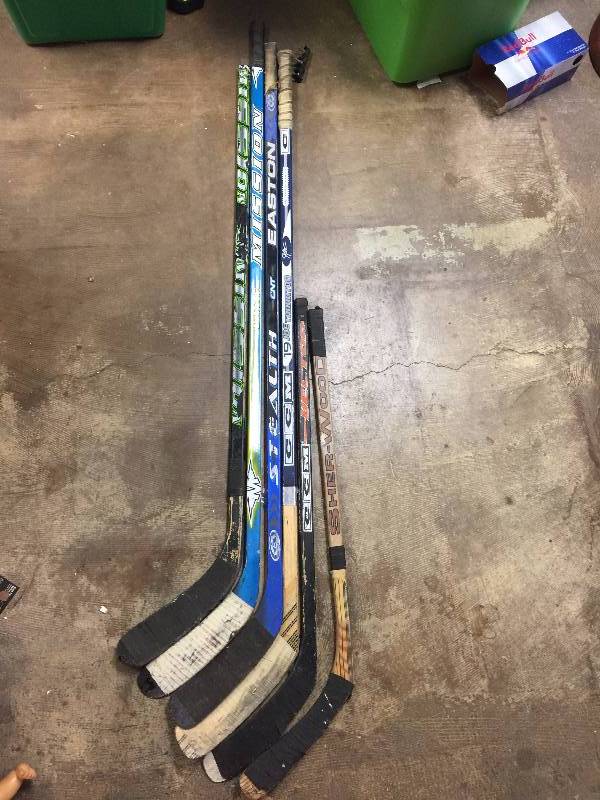 lot 64 image: six hockey sticks