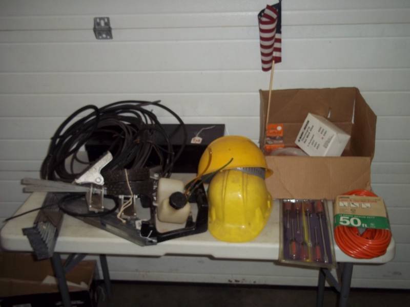 50 Orange Extension Cord, Pair of Yellow Hard Hats, Hot Glue, Small Gas Tank, Heavy Duty Electrical Wiring, Screwdrivers, Hand Siphon, Black Metal Tool Box