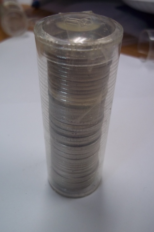Tube of Canadian quarters