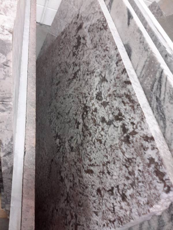 3 Pieces of misc. granite remnants, 1 piece of Quartz mfgrd stone